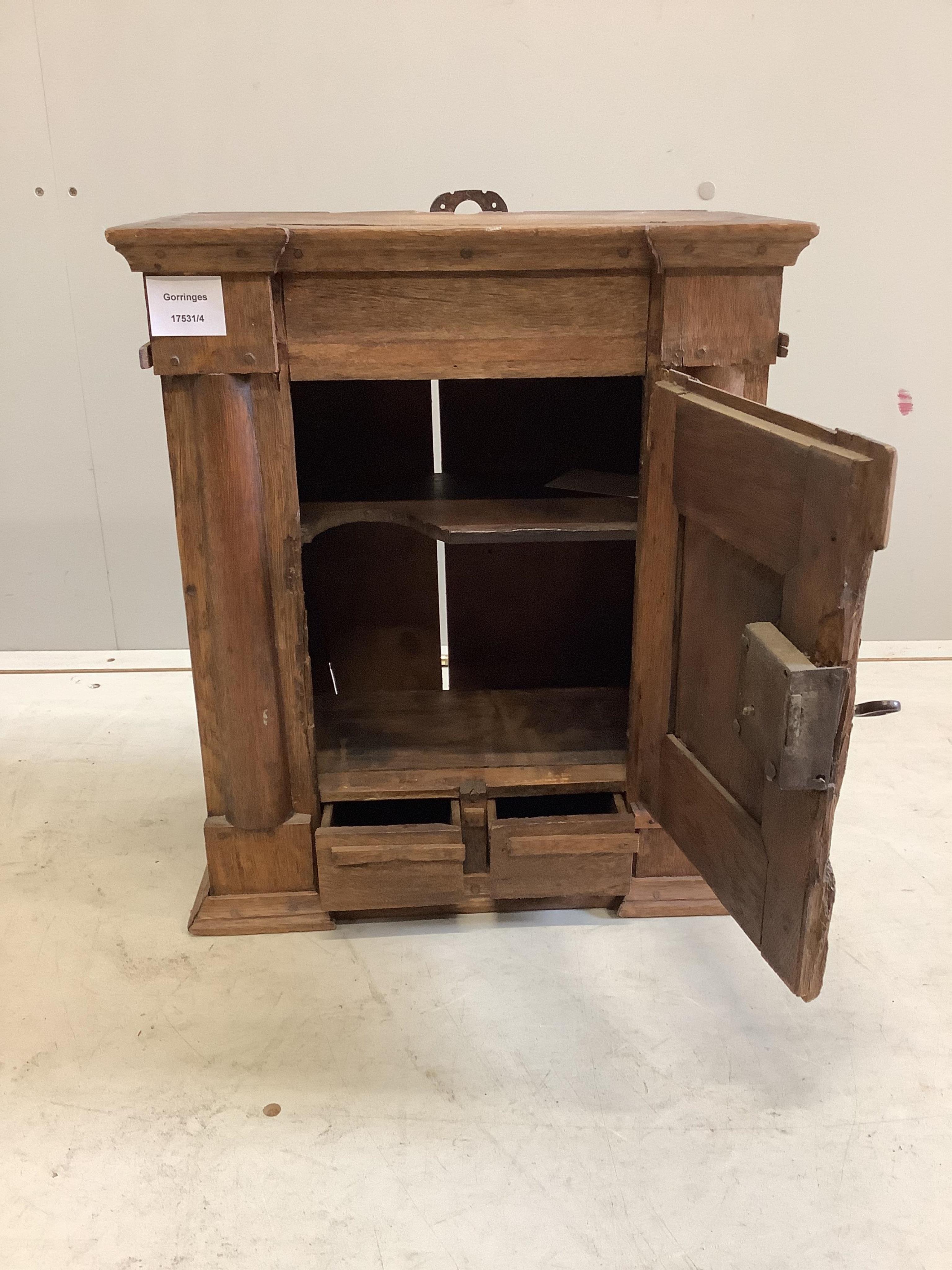 A small oak cupboard, width 38cm, depth 20cm, height 45cm